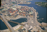 Gamla stan med Stockholm city i bakgrunden och slussen i förgrunden.